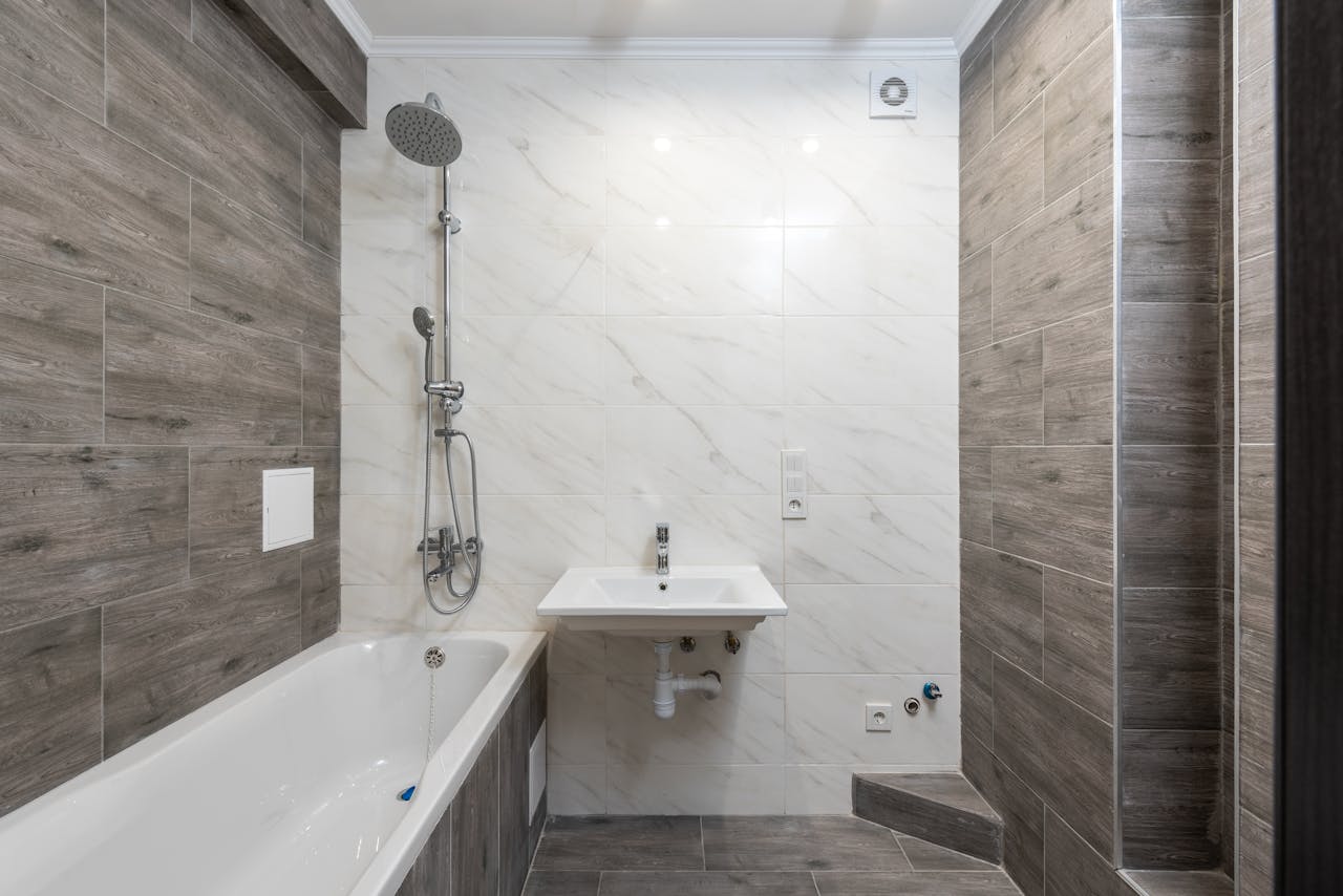 services-img Elegant modern bathroom interior with wooden details and sleek design.